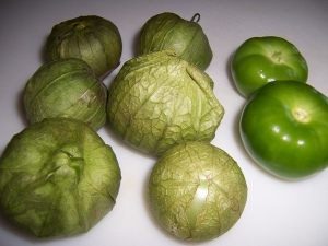 The tomatillos on the right have been peeled and washed.